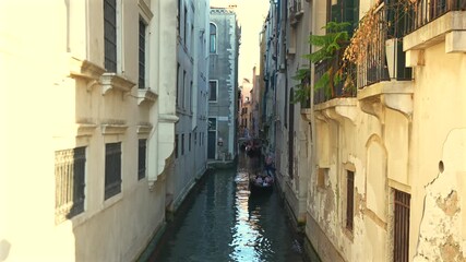 Gondola carrying passengers along canal Venice Italy June 29 2025 editorial