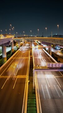Multi-Lane Highway Traffic at Night (Vertical, Timelapse): Shotoko/Metropolitan Expressway Wangan/Bayshore Route in Tokyo, Japan