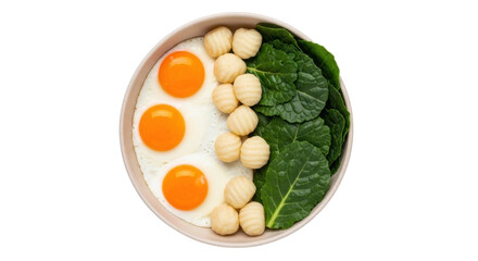 Isolated bowl of cooked food arrangement, including fried eggs, gnocchi, and fresh kale