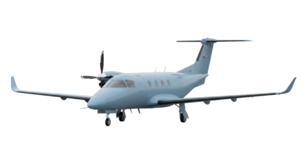 Isolated light blue turboprop aircraft parked on the ground with the wheels showing well