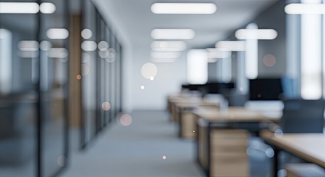 A spacious office with desks and chairs, a glass wall, and a window with natural light. - Powered by Adobe