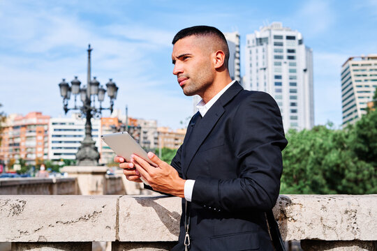 Business professional enjoying a moment of focus outdoors in a city setting