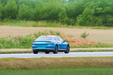 Fototapeta premium Prestigious luxury car on countryside road