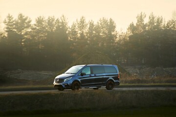 Fototapeta premium Hybrid automobile traveling through urban area