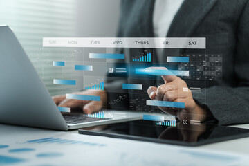 Businessmen use pen marks on the virtual screen calendar, Time management and scheduling concept. Business Planning Calendar Agenda work schedule, plan, goal, calendar