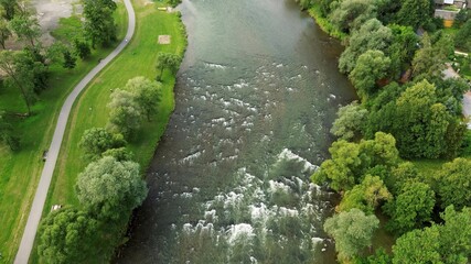 Mountain stream flowing through green terrain
