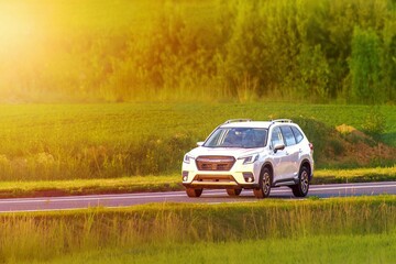 Fototapeta premium SUV on toll road through natural landscape