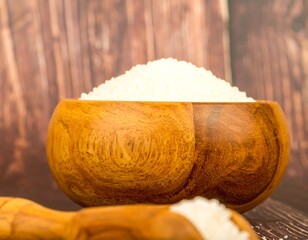 Wooden bowl filled with white grains