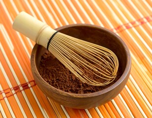 Wooden bowl with cocoa powder and whisk