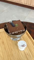 tiramisu cake original, italian dessert on wooden background.