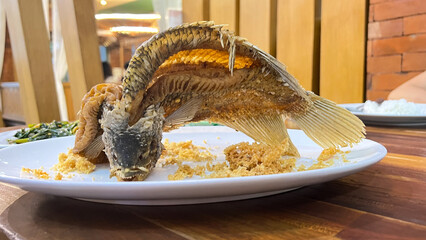 Fried flying gourami or gurame terbang is a popular indonesian dish of gourami fish that is butterflied and deep fried until crispy.