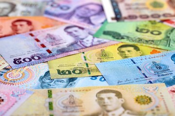 Thai baht currency money bills. The current banknotes lies on table in big amount