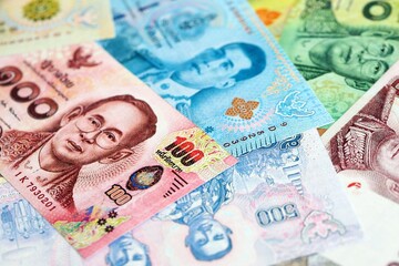 Thai baht currency money bills. The current banknotes lies on table in big amount