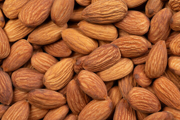 Whole almond nuts closeup, top view
