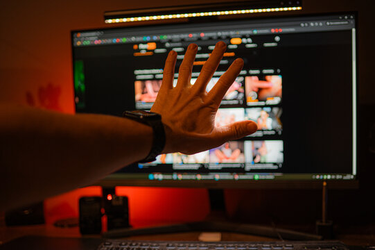 Digital Interaction A Hand Reaching Gracefully Towards the Screen for Connection Purposes