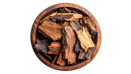 Top-down shot of tree bark pieces inside a wooden bowl