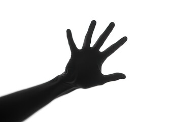 Fototapeta premium A complex shadow of a hand in a dynamic pose isolated on a white background 