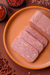 Spiced ham slices, canned meat for lunch sandwiches. Spiced ham as a food background