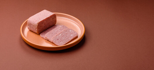 Spiced ham slices, canned meat for lunch sandwiches. Spiced ham as a food background