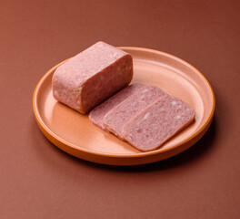 Spiced ham slices, canned meat for lunch sandwiches. Spiced ham as a food background