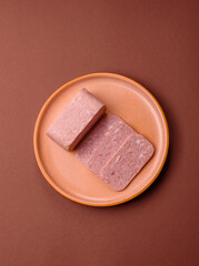 Spiced ham slices, canned meat for lunch sandwiches. Spiced ham as a food background
