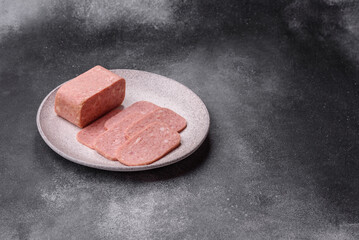 Spiced ham slices, canned meat for lunch sandwiches. Spiced ham as a food background