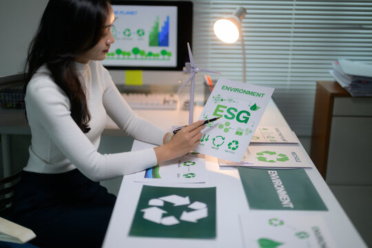 Woman analyzing ESG environment data for corporate sustainability planning
