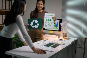 Businesswomen discussing ESG strategy integrating recycling and environment plans