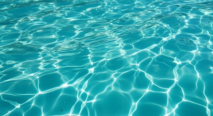 Fototapeta premium Vibrant turquoise water ripples create a mesmerizing, sparkling pattern on the surface of a sunny swimming pool, perfect for a refreshing summer day