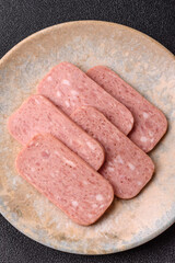 Spiced ham slices, canned meat for lunch sandwiches. Spiced ham as a food background
