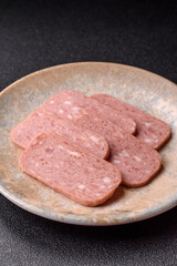 Spiced ham slices, canned meat for lunch sandwiches. Spiced ham as a food background
