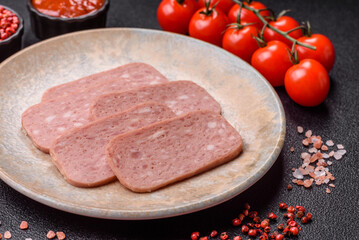 Spiced ham slices, canned meat for lunch sandwiches. Spiced ham as a food background
