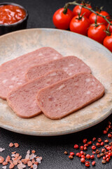 Spiced ham slices, canned meat for lunch sandwiches. Spiced ham as a food background
