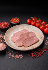 Spiced ham slices, canned meat for lunch sandwiches. Spiced ham as a food background