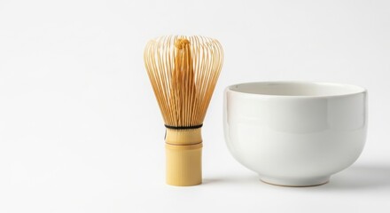 Traditional japanese matcha whisk and ceramic cup on white background
