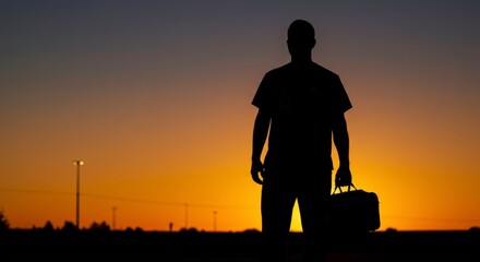 Silhouette of a healthcare worker at sunset symbolizes dedication and service