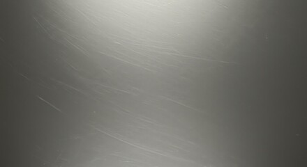 Subtle scratched metal surface backdrop with gradient light and dark texture