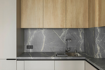 Grey table top, stainless steel sink with water tap, against a grey wall, minimalistic kitchen cabinets
