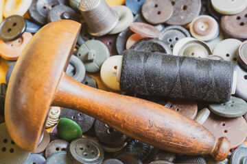 Collection of vintage sewing tools in an old sewing box