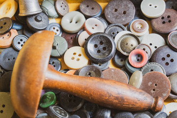 Collection of vintage sewing tools in an old sewing box