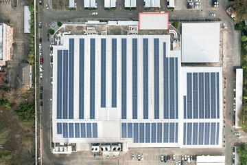 Industrial complex rooftop with solar panels: A modern industrial complex, showcasing rows of solar...