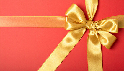 Red gift box with a gold ribbon and bow isolated for Christmas or Valentine's celebration