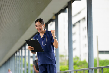 Happy nurse celebrating success while working in hospital