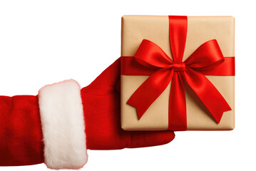 Santa Claus hand in red suit and white glove holding a brown gift box with red ribbon and bow on black background isolated on a transparent background