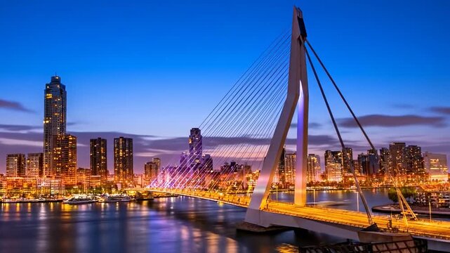 Scenic day to night timelapse of Erasmus bridge in Rotterdam, Holland. Panorama of business and financial center