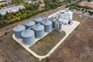 Aerial view to a metal silos for grain drying. Agricultural industry
