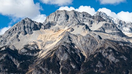 Rugged mountain peaks under blue sky