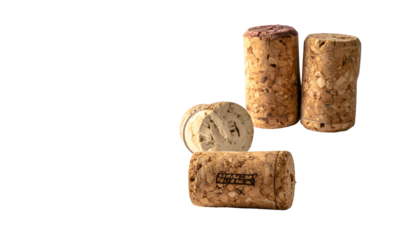 Close-up of four natural wine bottle corks on a dark background