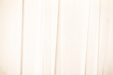 Obraz premium Subtle folds of off-white fabric background texture