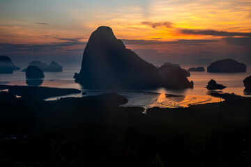 Beautiful and colorful sunrise over the sea. Large rocks in the sea. Dawn in Thailand. Colorful sky in the morning.	
